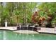 Relaxing pool area with fire bowls and lush landscaping at 6092 Carlisle Ln, Alpharetta, GA 30022