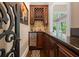 Wet bar with wine rack, sink, and granite countertop at 6092 Carlisle Ln, Alpharetta, GA 30022