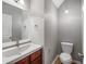 Simple bathroom with vanity, toilet and mirror at 7167 Rigel Sw Bnd, Atlanta, GA 30331