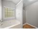 Bathroom featuring a shower and garden tub at 7167 Rigel Sw Bnd, Atlanta, GA 30331