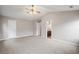 Large bedroom with ensuite bathroom access and ceiling fan at 7167 Rigel Sw Bnd, Atlanta, GA 30331