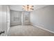 Bright bedroom with ceiling fan and ample closet space at 7167 Rigel Sw Bnd, Atlanta, GA 30331