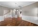 Spacious dining room with hardwood floors and views to staircase at 7167 Rigel Sw Bnd, Atlanta, GA 30331