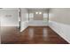 Bright dining room features hardwood floors and wainscoting at 7167 Rigel Sw Bnd, Atlanta, GA 30331