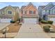 Two-story townhome with stone accents and a two-car garage at 7167 Rigel Sw Bnd, Atlanta, GA 30331
