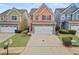 Two-story townhome with stone accents and a two-car garage at 7167 Rigel Sw Bnd, Atlanta, GA 30331