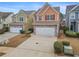 Two-story townhome with stone accents and a two-car garage at 7167 Rigel Sw Bnd, Atlanta, GA 30331
