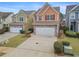 Two-story townhome with stone accents and a two-car garage at 7167 Rigel Sw Bnd, Atlanta, GA 30331