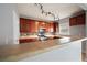 Kitchen with wood cabinets, tile backsplash and breakfast bar at 7167 Rigel Sw Bnd, Atlanta, GA 30331