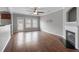 Living room features hardwood floors, fireplace and ceiling fan at 7167 Rigel Sw Bnd, Atlanta, GA 30331