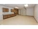 Large basement garage with workbenches and storage at 340 Shyrewood Dr, Lawrenceville, GA 30043