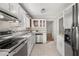 Updated kitchen featuring stainless steel appliances and gray countertops at 4129 Duesenberg Dr, Tucker, GA 30084