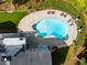 Aerial view of kidney-shaped pool with surrounding patio at 5917 N Helton Rd, Villa Rica, GA 30180