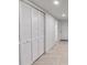 White louvered doors and neutral tile flooring in basement at 7077 Milam Rd, Winston, GA 30187