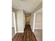 Bright hallway with wood-look flooring and neutral walls at 3987 Cameron Close, Ellenwood, GA 30294