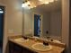 Double sink bathroom with large mirror and modern lighting at 5462 Union Hill Ct, Union City, GA 30291