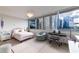 Bedroom with city views and comfortable bed at 700 Park Regency Ne Pl # 1306, Atlanta, GA 30326