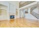 Two-story Gathering room featuring hardwood floors, built-in shelving, and a fireplace at 269 Gucci Cir, Stockbridge, GA 30281