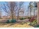 Landscaped yard with trees and deck access at 269 Gucci Cir, Stockbridge, GA 30281