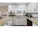 Cozy kitchen with granite countertops and white cabinets at 484 Coolsprings Trl, Woodstock, GA 30188