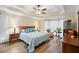 Main bedroom with king bed, wood floors, and tray ceiling at 484 Coolsprings Trl, Woodstock, GA 30188