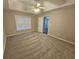 Bright bedroom featuring a large window and plush carpeting at 6969 Pine Shadow Way, Winston, GA 30187