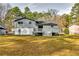 Spacious backyard with a deck and a large grassy area at 6685 Buckhurst Trl, Atlanta, GA 30349