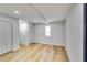 Finished basement with light wood flooring at 6685 Buckhurst Trl, Atlanta, GA 30349