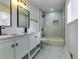 Modern bathroom with double vanity and walk-in shower at 6685 Buckhurst Trl, Atlanta, GA 30349