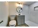 Basement bathroom with walk-in shower and gray vanity at 6685 Buckhurst Trl, Atlanta, GA 30349