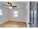 Bedroom with hardwood floors, ceiling fan, and closet at 6685 Buckhurst Trl, Atlanta, GA 30349