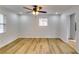 Spacious bedroom with hardwood floors and a ceiling fan at 6685 Buckhurst Trl, Atlanta, GA 30349