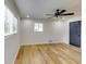 Spacious bedroom featuring hardwood floors and ceiling fan at 6685 Buckhurst Trl, Atlanta, GA 30349