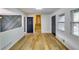 Light and airy entryway with hardwood floors and modern doors at 6685 Buckhurst Trl, Atlanta, GA 30349