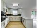Modern kitchen featuring white cabinets, quartz countertops, and stainless steel appliances at 6685 Buckhurst Trl, Atlanta, GA 30349