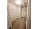 Large walk-in closet with double hanging rods and carpeted floor at 6921 Foxmoor Way, Douglasville, GA 30134