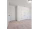 Large bedroom with double door closet and neutral wall colors at 7264 Eton Ln, Locust Grove, GA 30248