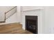 Modern gas fireplace with a white mantel and hardwood floors at 7264 Eton Ln, Locust Grove, GA 30248