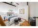 Spacious bedroom with hardwood floors, plush bedding and modern decor at 150 Walker Sw St # 5, Atlanta, GA 30313