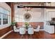 Modern glass dining table with white chairs, exposed brick and kitchen views at 150 Walker Sw St # 5, Atlanta, GA 30313