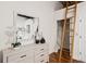 Modern dresser with a large mirror reflecting the bedroom at 150 Walker Sw St # 5, Atlanta, GA 30313