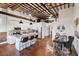 Open concept kitchen features white cabinets and a large island at 150 Walker Sw St # 5, Atlanta, GA 30313
