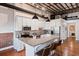 Modern kitchen with island, stainless steel appliances, and white cabinetry at 150 Walker Sw St # 5, Atlanta, GA 30313
