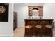 Wet bar with cabinetry and seating in finished basement at 2960 Millwater Crossing, Dacula, GA 30019