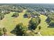 Aerial view of a lush green golf course with surrounding landscape at 2960 Millwater Crossing, Dacula, GA 30019