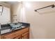 Powder room with glass vessel sink and dark granite vanity at 5170 Stone Croft Trl, Atlanta, GA 30331