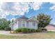 Gray house with a three-car garage and manicured landscaping at 5170 Stone Croft Trl, Atlanta, GA 30331