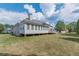 House exterior showcasing a sunroom and backyard at 5170 Stone Croft Trl, Atlanta, GA 30331