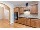 Spacious kitchen with wood cabinets, granite counters, and stainless steel appliances at 5170 Stone Croft Trl, Atlanta, GA 30331