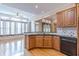Eat-in kitchen features wood cabinets, granite counters, and a breakfast bar at 5170 Stone Croft Trl, Atlanta, GA 30331